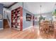 Open floor plan with dining area featuring wood-look floors and view to the kitchen at 18206 E Loyola Dr, Aurora, CO 80013