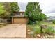 Charming two-story home with tan siding, brick accents, and a well-maintained front yard at 18206 E Loyola Dr, Aurora, CO 80013