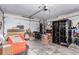 Spacious garage with a mix of stored boxes and household items, and an automatic door opener at 18206 E Loyola Dr, Aurora, CO 80013