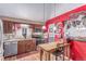 Eat-in kitchen features wood cabinets, granite countertops, and stainless steel appliances at 18206 E Loyola Dr, Aurora, CO 80013