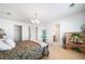 Bright bedroom with a king-size bed, en-suite bathroom access, and built-in shelving at 678 Kryptonite Dr, Castle Rock, CO 80108