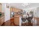 Spacious kitchen with island, stainless steel appliances, and hardwood floors at 678 Kryptonite Dr, Castle Rock, CO 80108