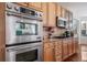 Modern kitchen with stainless steel double oven and microwave at 678 Kryptonite Dr, Castle Rock, CO 80108