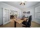 Bright home office with view into dining room at 678 Kryptonite Dr, Castle Rock, CO 80108