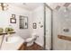 Inviting bathroom with glass shower, classic vanity, and decorative wall art at 1425 Autumnwood Ln, Evergreen, CO 80439