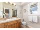 Bathroom featuring a single vanity, a large mirror, and tiled walk-in shower at 1425 Autumnwood Ln, Evergreen, CO 80439