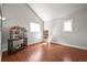 Neutral bedroom with hardwood floors, natural light, and vaulted ceilings at 1425 Autumnwood Ln, Evergreen, CO 80439