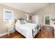 Cozy bedroom with hardwood floors, natural light, and an exterior door to the balcony at 1425 Autumnwood Ln, Evergreen, CO 80439