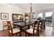 Spacious dining room with wood floors, chandelier and bright windows at 1425 Autumnwood Ln, Evergreen, CO 80439