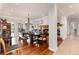 Bright dining room with wood floors, fireplace and access to the outside at 1425 Autumnwood Ln, Evergreen, CO 80439