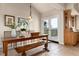 Dining room with tile floors, a view, and access to the outside at 1425 Autumnwood Ln, Evergreen, CO 80439