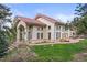 Beautiful home featuring a stone patio and stunning outdoor space perfect for entertaining at 1425 Autumnwood Ln, Evergreen, CO 80439
