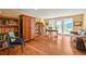 Inviting home office with hardwood floors, custom bookshelves, and french doors to the exterior at 1425 Autumnwood Ln, Evergreen, CO 80439