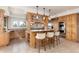 Well-equipped kitchen with wooden cabinetry, granite countertops, and stainless steel appliances at 1425 Autumnwood Ln, Evergreen, CO 80439