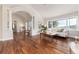 Spacious living room with wood floors, bright windows, and plenty of seating at 1425 Autumnwood Ln, Evergreen, CO 80439