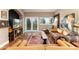 Cozy living room featuring a leather sofa, hardwood floors, and natural light at 1425 Autumnwood Ln, Evergreen, CO 80439