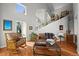 Comfortable living room with rustic touches, hardwood floors, and a charming staircase at 1425 Autumnwood Ln, Evergreen, CO 80439