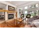 Cozy living room with a fireplace and access to the backyard at 1425 Autumnwood Ln, Evergreen, CO 80439