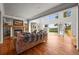 Bright and open living room with a cozy fireplace and sliding glass doors to the outdoor space at 1425 Autumnwood Ln, Evergreen, CO 80439