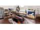 Bright studio with art supplies, a desk, and wood floors at 1425 Autumnwood Ln, Evergreen, CO 80439