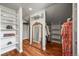 Bright walk-in closet with built-in shelving and a mirror at 1425 Autumnwood Ln, Evergreen, CO 80439