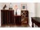 Rustic basement wine storage with wooden wine racks and tiled floor at 1425 Autumnwood Ln, Evergreen, CO 80439