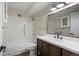 Well-lit bathroom with modern vanity and shower-tub combination at 775 S Alton Way # 5B, Denver, CO 80247