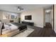 Sunlit bedroom featuring hardwood-style floors, neutral walls, and modern furnishings at 775 S Alton Way # 5B, Denver, CO 80247