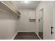 Empty walk-in closet with shelving and a full-length mirror at 775 S Alton Way # 5B, Denver, CO 80247