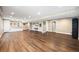 Spacious finished basement featuring bar, modern flooring and ample lighting at 2209 Lupine Pl, Erie, CO 80516