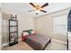 Neutral bedroom offers a ceiling fan and light, closet, and modern decor at 2209 Lupine Pl, Erie, CO 80516