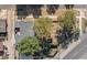 Aerial view of a home highlighting the roof and the spacious backyard with mature trees and garden at 3102 N Columbine St, Denver, CO 80205