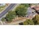 Aerial view of a charming home with lush green trees in the yard and a brick exterior at 3102 N Columbine St, Denver, CO 80205