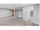 Spacious basement area with neutral carpet and storage at 3102 N Columbine St, Denver, CO 80205