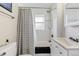 Updated bathroom features a shower-tub combo and modern sink at 3102 N Columbine St, Denver, CO 80205