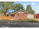 Charming brick home features a well-maintained front yard and mature trees at 3102 N Columbine St, Denver, CO 80205