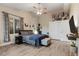 Spacious main bedroom with large window, ceiling fan, and closet at 3102 N Columbine St, Denver, CO 80205