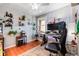 Cozy home office has hardwood floors and built-in shelving at 3102 N Columbine St, Denver, CO 80205