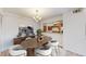 Inviting dining room area with modern decor, a stylish table, and access to the kitchen at 12120 Melody Dr # 308, Westminster, CO 80234