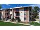 Exterior angle view of the multi-level residential home featuring balconies, brick, and stone at 12120 Melody Dr # 308, Westminster, CO 80234