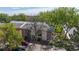 Exterior view of residences surrounded by mature trees and green spaces at 12120 Melody Dr # 308, Westminster, CO 80234