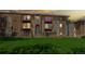 Exterior full view of multi-level residential home with brick, stone, and private balconies at 12120 Melody Dr # 308, Westminster, CO 80234