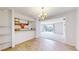 The living room features open access to kitchen and natural light from a large sliding door at 12120 Melody Dr # 308, Westminster, CO 80234