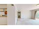 Bright living room featuring neutral carpet and access to a private balcony for seamless indoor/outdoor living at 12120 Melody Dr # 308, Westminster, CO 80234
