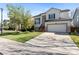 Beautiful two-story home with well-kept lawn, stone accents, and a convenient two-car garage at 8864 S Field Ct, Littleton, CO 80128