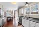 Kitchen and dining area with stainless steel appliances and lots of natural light at 8864 S Field Ct, Littleton, CO 80128