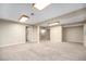 Spacious carpeted basement with neutral walls and multiple access points at 2575 S Independence Ct, Lakewood, CO 80227