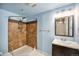 Basement bathroom with shower, vanity, and mirror at 2575 S Independence Ct, Lakewood, CO 80227