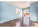 Light blue bedroom with hardwood floors and sliding glass doors to a deck at 2575 S Independence Ct, Lakewood, CO 80227