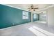 Bedroom with teal walls and mirrored closet doors at 2575 S Independence Ct, Lakewood, CO 80227